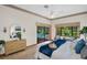 Tranquil main bedroom with a sliding glass door leading to the backyard pool area at 10 Greenhaven Cir, Oldsmar, FL 34677