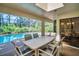 Screened patio dining area with access to pool and access to dining room at 10 Greenhaven Cir, Oldsmar, FL 34677