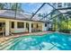 This screened-in pool offers a relaxing outdoor space with a covered patio for dining and entertainment at 10 Greenhaven Cir, Oldsmar, FL 34677