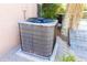 The AC unit sits on a concrete pad next to the home at 10918 Lake Andover Blvd, Tampa, FL 33624