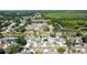 A neighborhood aerial, featuring diverse homes and community pond at 10918 Lake Andover Blvd, Tampa, FL 33624