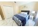 Comfortable bedroom featuring a ceiling fan, closet, and serene design, ideal for relaxation at 10918 Lake Andover Blvd, Tampa, FL 33624