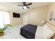 Relaxing bedroom with TV, closet, and calming decor, creating a peaceful retreat at 10918 Lake Andover Blvd, Tampa, FL 33624