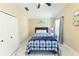 Sunny bedroom with a ceiling fan, window, and neutral design, making it calming and inviting at 10918 Lake Andover Blvd, Tampa, FL 33624