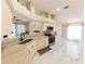 Well-lit kitchen with white cabinets, stainless steel appliances, and marble countertops at 10918 Lake Andover Blvd, Tampa, FL 33624