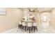 Open concept living area with bar seating and modern marble flooring at 10918 Lake Andover Blvd, Tampa, FL 33624