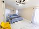 Charming main bedroom with stylish decor, lots of natural light, and modern ceiling fan at 10918 Lake Andover Blvd, Tampa, FL 33624