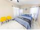 Inviting main bedroom with bright natural light, modern ceiling fan, and stylish accents at 10918 Lake Andover Blvd, Tampa, FL 33624