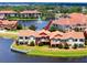 Beautiful waterfront townhomes showcasing a peaceful community with a central fountain and scenic surroundings at 11 Franklin S Ct # C, St Petersburg, FL 33711