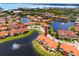 Waterfront townhome features lush landscaping with water features and community greenspace at 11 Franklin S Ct # C, St Petersburg, FL 33711