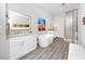 Modern bathroom with a standalone tub, double vanity and sleek glass shower at 11 Franklin S Ct # C, St Petersburg, FL 33711
