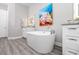 Elegant bathroom with a standalone tub and stylish vanity at 11 Franklin S Ct # C, St Petersburg, FL 33711