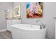 Close-up of a modern, standalone white bathtub in bathroom at 11 Franklin S Ct # C, St Petersburg, FL 33711