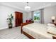 Bright bedroom featuring a large window with outdoor views and stylish decor at 11 Franklin S Ct # C, St Petersburg, FL 33711