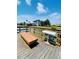 Community boat dock with cleaning station, bench and open water views at 11 Franklin S Ct # C, St Petersburg, FL 33711
