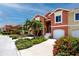 Lovely townhome featuring a garage, beautiful landscaping, and a private front entrance at 11 Franklin S Ct # C, St Petersburg, FL 33711