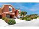 Attractive townhome with an attached garage, lush landscaping, and a well-maintained exterior at 11 Franklin S Ct # C, St Petersburg, FL 33711