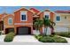 Charming townhome with an attached garage, well-maintained landscaping, and attractive exterior accents at 11 Franklin S Ct # C, St Petersburg, FL 33711