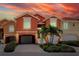 Inviting townhome featuring a private garage, beautiful landscaping, and elegant architectural details at 11 Franklin S Ct # C, St Petersburg, FL 33711