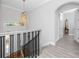 Elegant foyer with staircase, hardwood floors, and a chandelier at 11 Franklin S Ct # C, St Petersburg, FL 33711