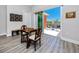 Game room with chess table and chairs that leads to a private outdoor seating area at 11 Franklin S Ct # C, St Petersburg, FL 33711