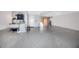Spacious garage with speckled epoxy flooring, laundry area, and access to the outside at 11 Franklin S Ct # C, St Petersburg, FL 33711