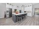 Beautiful kitchen featuring stainless steel appliances, white cabinets, and a gray island with seating at 11 Franklin S Ct # C, St Petersburg, FL 33711