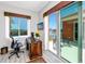 Office space with a desk, ergonomic chair, and sliding doors to a private patio at 11 Franklin S Ct # C, St Petersburg, FL 33711