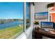 Office window shows a picturesque view of the lake and nearby community at 11 Franklin S Ct # C, St Petersburg, FL 33711