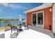 Private patio with outdoor seating area and peaceful view of the lake at 11 Franklin S Ct # C, St Petersburg, FL 33711