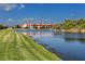 Scenic water view overlooking the fountain, lush lawns, and colorful homes at 11 Franklin S Ct # C, St Petersburg, FL 33711