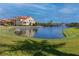 Beautiful water view with fountain feature, lush lawns, and colorful homes at 11 Franklin S Ct # C, St Petersburg, FL 33711