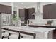 Well-appointed kitchen with a central island, stainless steel appliances, and stylish dark wood cabinets at 114 W Plymouth St, Tampa, FL 33603