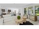 Stylish living room featuring a large sectional sofa, modern decor, and ample natural light at 114 W Plymouth St, Tampa, FL 33603