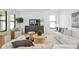 Well-lit living room featuring modern furniture, stylish decor, and an open, airy feel at 114 W Plymouth St, Tampa, FL 33603