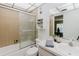 Bright bathroom featuring a vanity with mirror and cabinet, shower and bathtub combination, and a toilet at 11802 Foxrun Ln, Temple Terrace, FL 33617