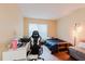 Comfortable bedroom with hardwood floors, a window, and functional study space at 11802 Foxrun Ln, Temple Terrace, FL 33617