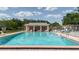 A refreshing community pool featuring a spacious sundeck with lounge chairs, perfect for relaxation and leisure at 11802 Foxrun Ln, Temple Terrace, FL 33617