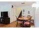 Charming dining area featuring a round table, four chairs, and direct access to the adjacent staircase at 11802 Foxrun Ln, Temple Terrace, FL 33617
