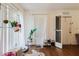 Cozy entryway with natural light, hardwood floors, a shoe rack, and pet supplies for a comfortable home at 11802 Foxrun Ln, Temple Terrace, FL 33617