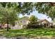 Charming home exterior showcasing lush landscaping and a well-maintained lawn at 11802 Foxrun Ln, Temple Terrace, FL 33617