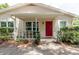 Inviting front porch with visible house number and charming curb appeal at 11802 Foxrun Ln, Temple Terrace, FL 33617