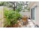 Secluded patio featuring a privacy fence, outdoor seating, and beautiful greenery at 11802 Foxrun Ln, Temple Terrace, FL 33617