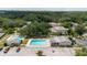 Image shows community amenities including a swimming pool, clubhouse, and parking at 11802 Foxrun Ln, Temple Terrace, FL 33617