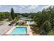 Community amenities including swimming pool, clubhouse, tennis courts and parking at 11802 Foxrun Ln, Temple Terrace, FL 33617