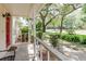 Covered front porch, great curb appeal, and a glimpse of the street at 11802 Foxrun Ln, Temple Terrace, FL 33617