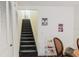 Stairway leading upstairs with neutral tones and a storage closet on the side at 11802 Foxrun Ln, Temple Terrace, FL 33617