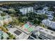 Overhead aerial view showcases the community pool, manicured grounds, and proximity to residential buildings at 1235 S Highland Ave # 2-207, Clearwater, FL 33756