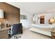 Bedroom featuring desk area, wood floors, large windows, dresser, and closet access at 1235 S Highland Ave # 2-207, Clearwater, FL 33756