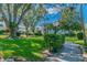 Serene community grounds with mature trees, manicured lawns, and walking paths, fostering a peaceful environment at 1235 S Highland Ave # 2-207, Clearwater, FL 33756